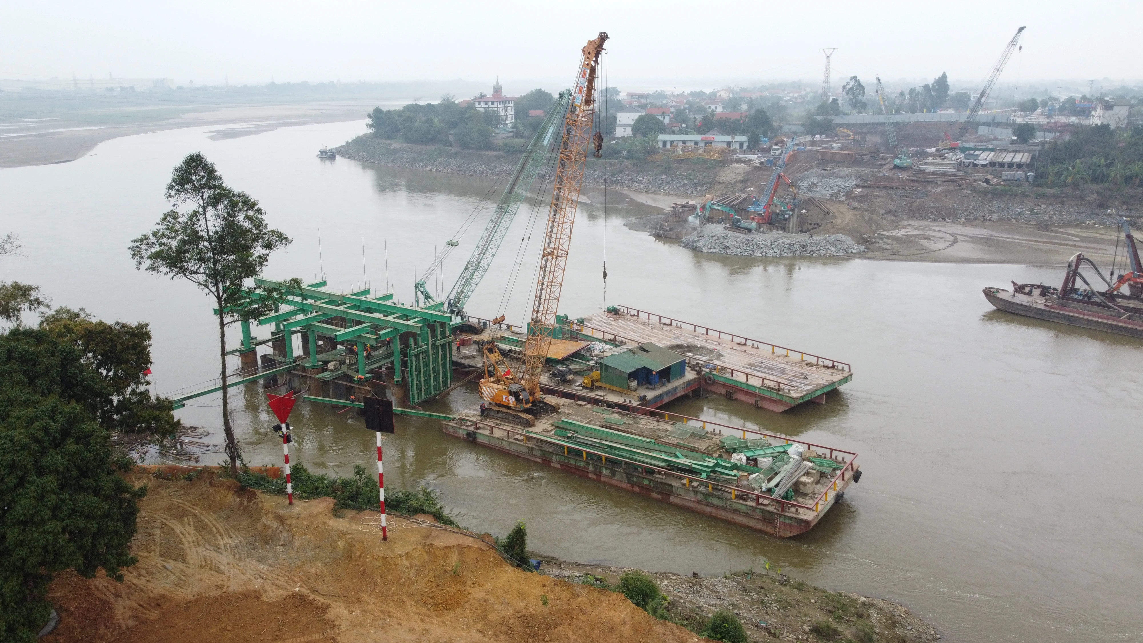 At the Construction Site of the New Phong Chau Bridge
