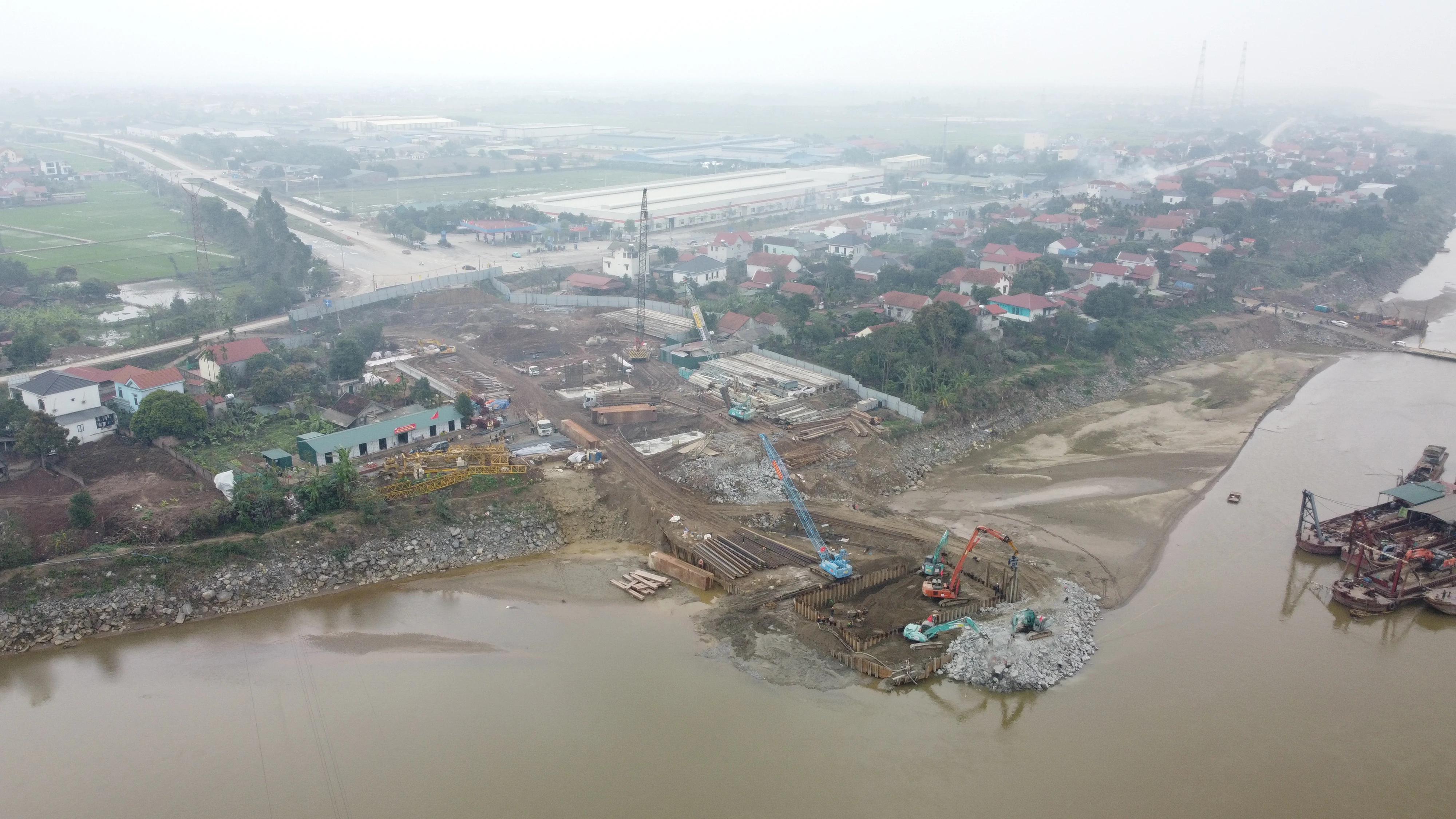 At the Construction Site of the New Phong Chau Bridge